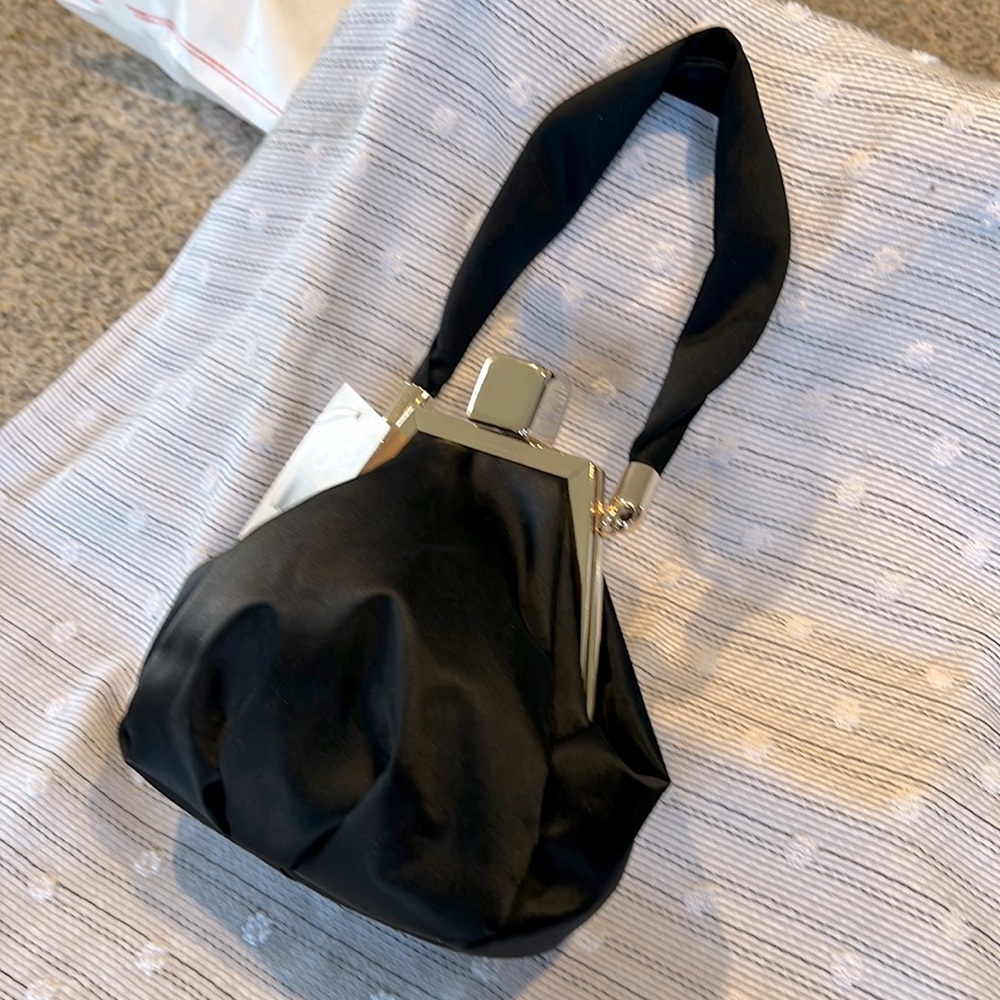 Evening bag beautiful black satin inside purple . NWT.